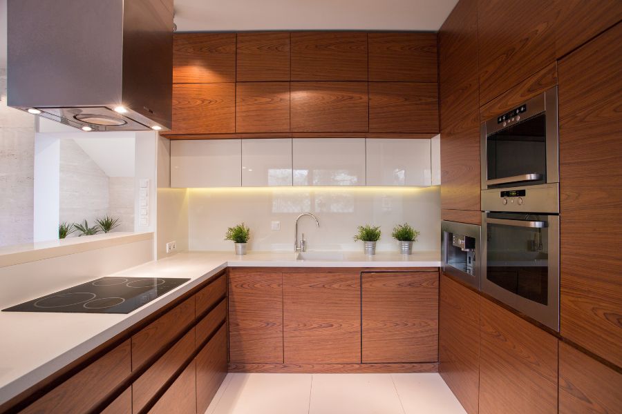 Modern kitchen with cabinets wrapped in vinyl finishes