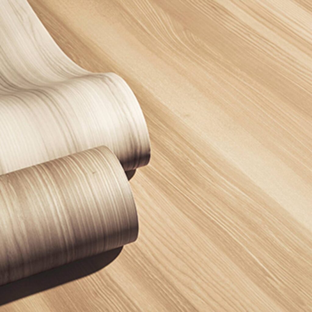 Premium wood-grain vinyl finish roll showcasing Hygia’s realistic texture and elegant light oak design
