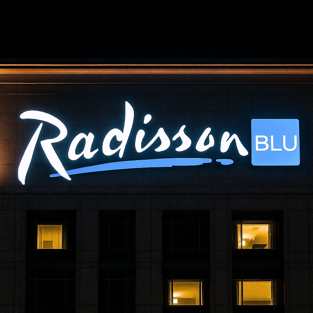 Well-lit Radisson Blu sign after maintenance and cleaning work by Hygia high rise team